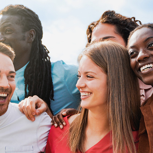 A group of business people laughing and smiling in a group